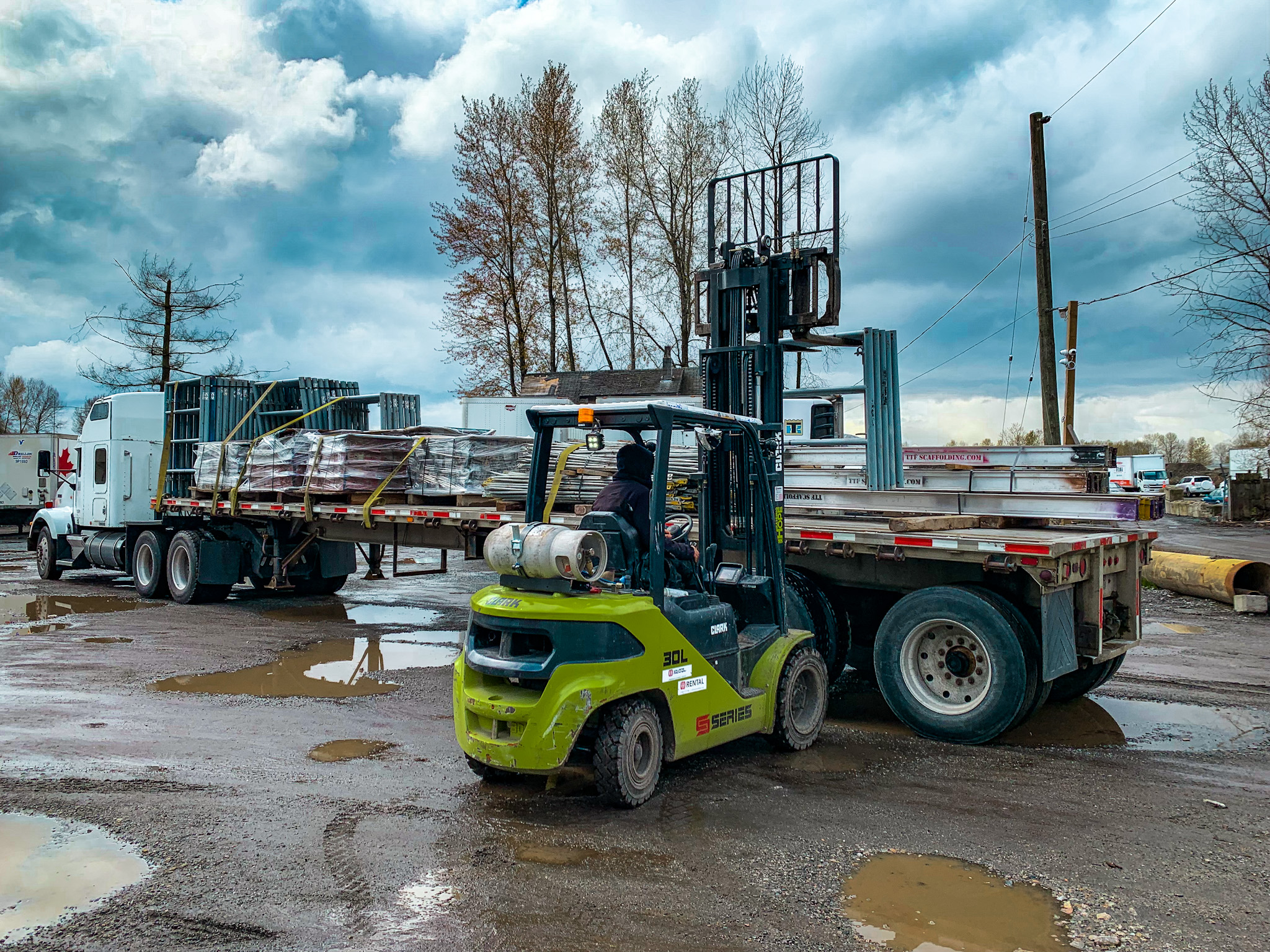 TTF Scaffolding flatbed truck being loaded with shoring equipment