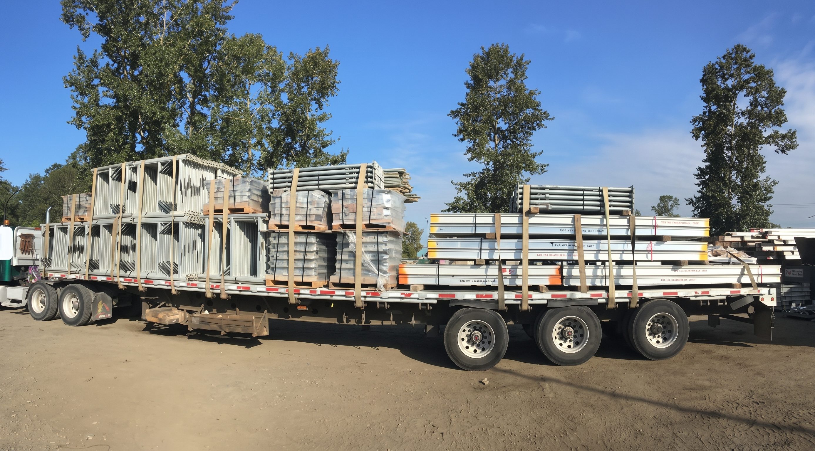 TTF Scaffolding delivery truck TTF Scaffolding flatbed truck loaded with scaffolding and shoring equipment
